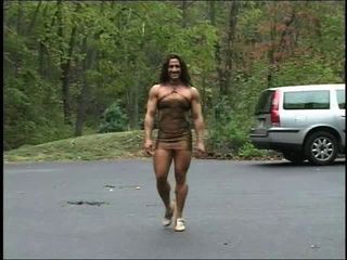 muscle chick in a penurious dress" target="_blank