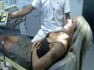 Busty tattooed blonde rinses her mouth out with the dentists man juice